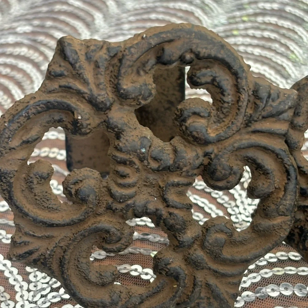 Antique cast iron curtain accents
